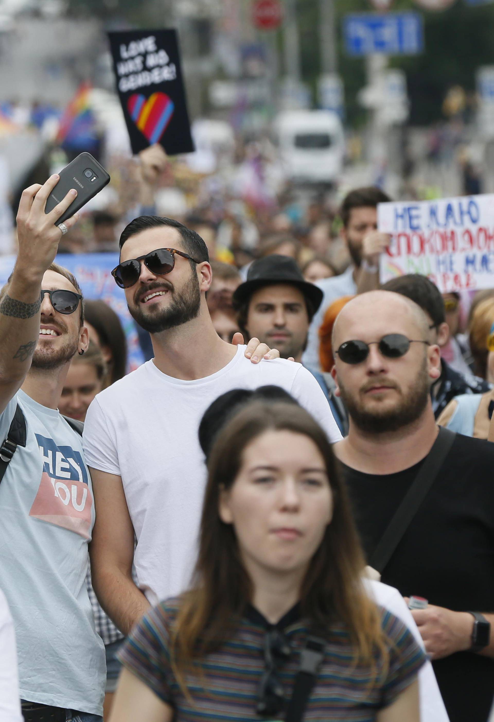 Participants take a selfie during the Equality March in Kiev
