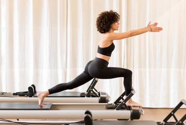 Full,Body,Side,View,Of,Fit,Woman,In,Sportswear,Doing