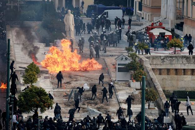 People gather in front of the Greek parliament during a protest, in Athens