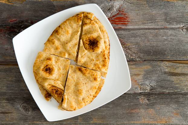 Naan flatbread baked in a traditional tandoor