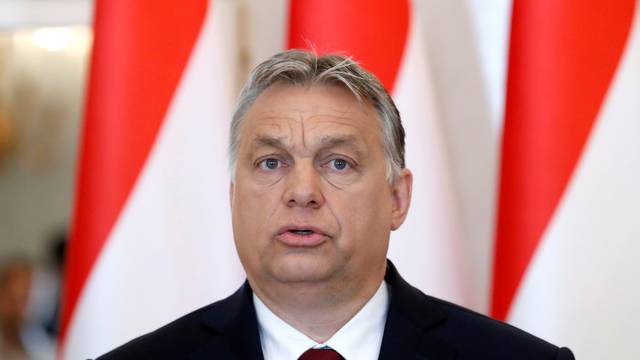 Hungarian PM Orban gives a statement to the media at the Presidential Palace in Budapest