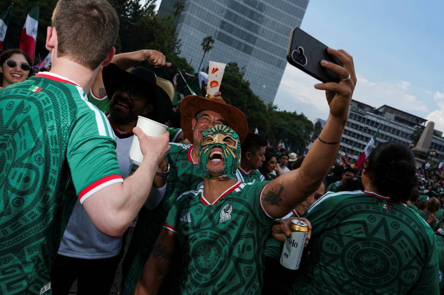 People celebrate Mexico's victory in the opening match of the 2026 FIFA World Cup, in Mexico City