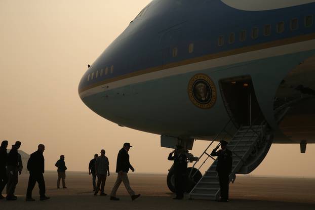 U.S. President Donald Trump boards Air Force One after visiting Paradise in California