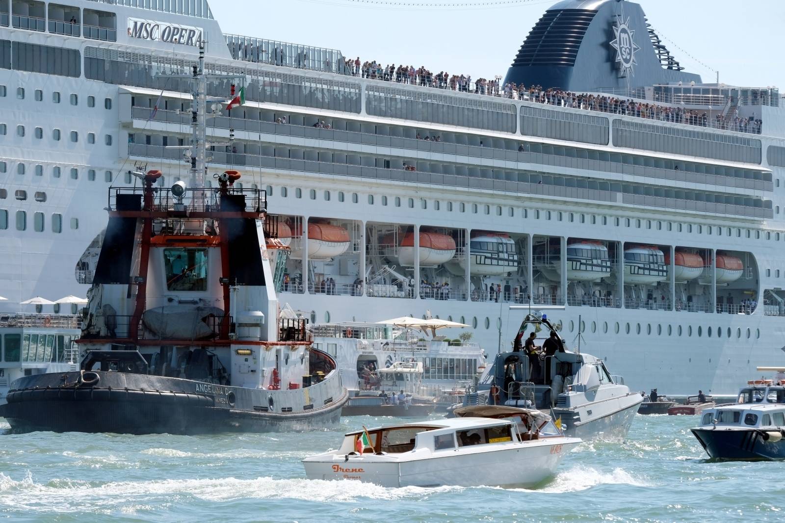 The cruise ship MSC Opera loses control and crashes against a smaller tourist boat at the San Basilio dock in Venice