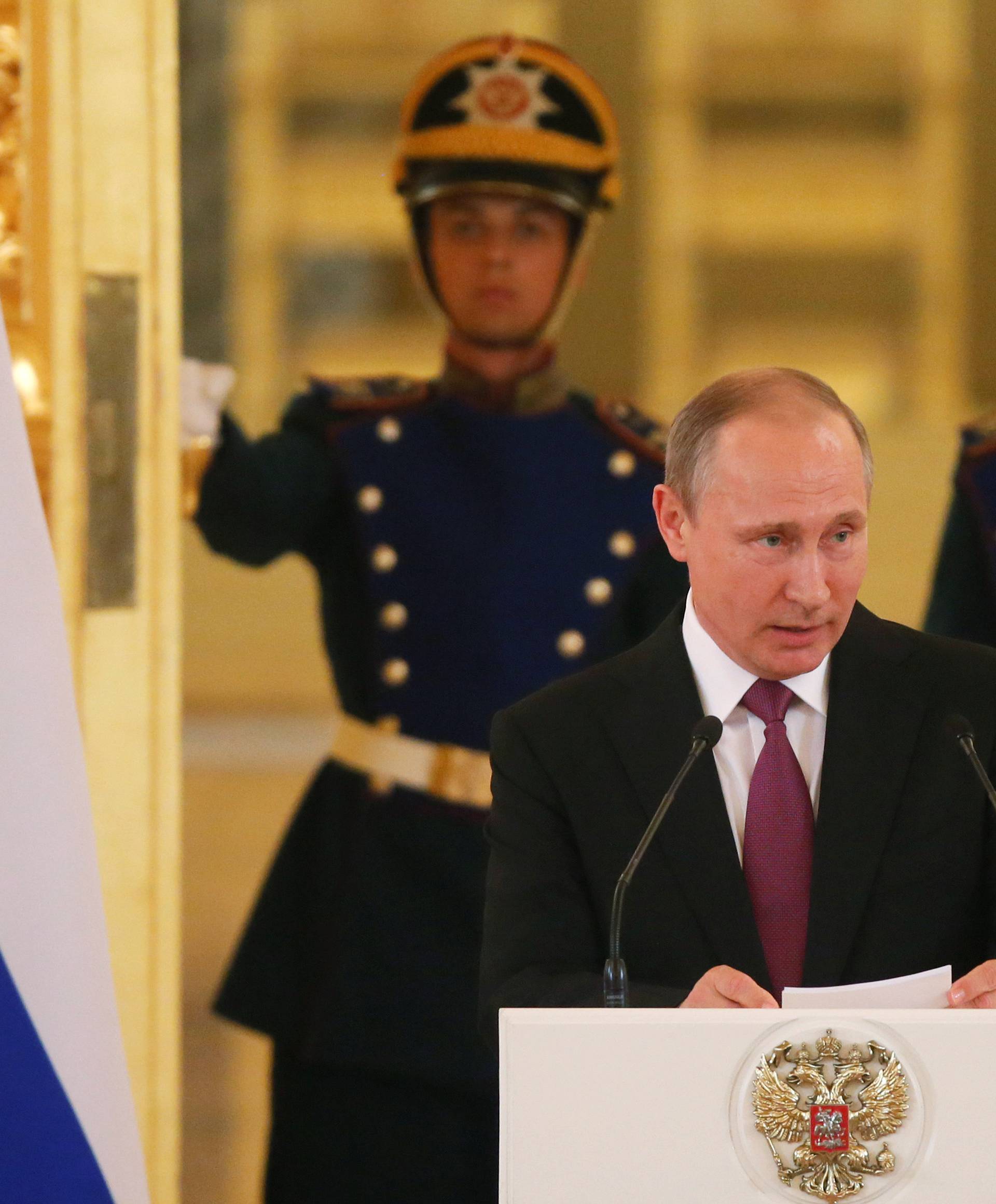 Russian President Putin speaks during personal send-off for members of Russian Olympic team at Kremlin in Moscow