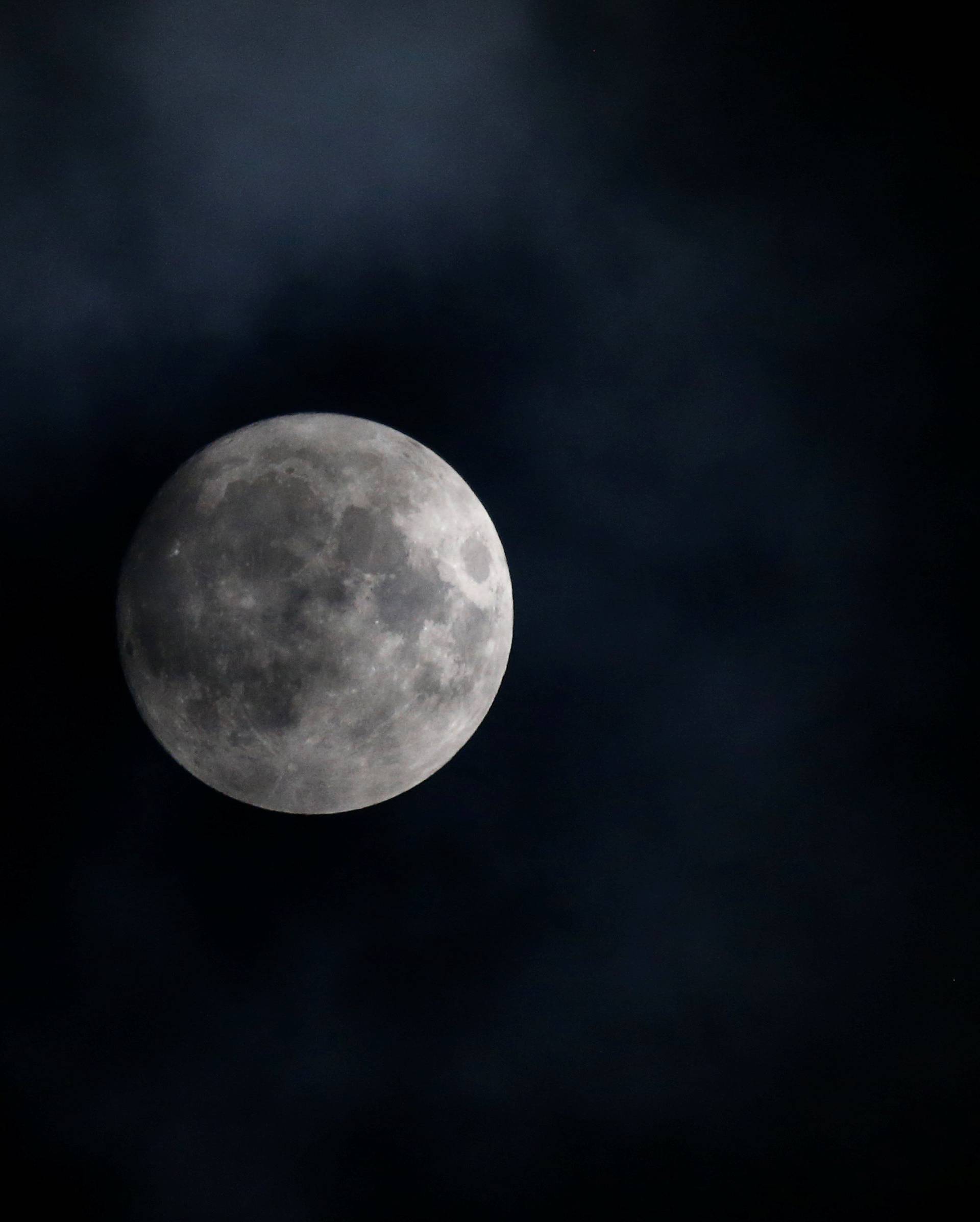 The moon appears in the sky a day before the "supermoon" spectacle in Vienna