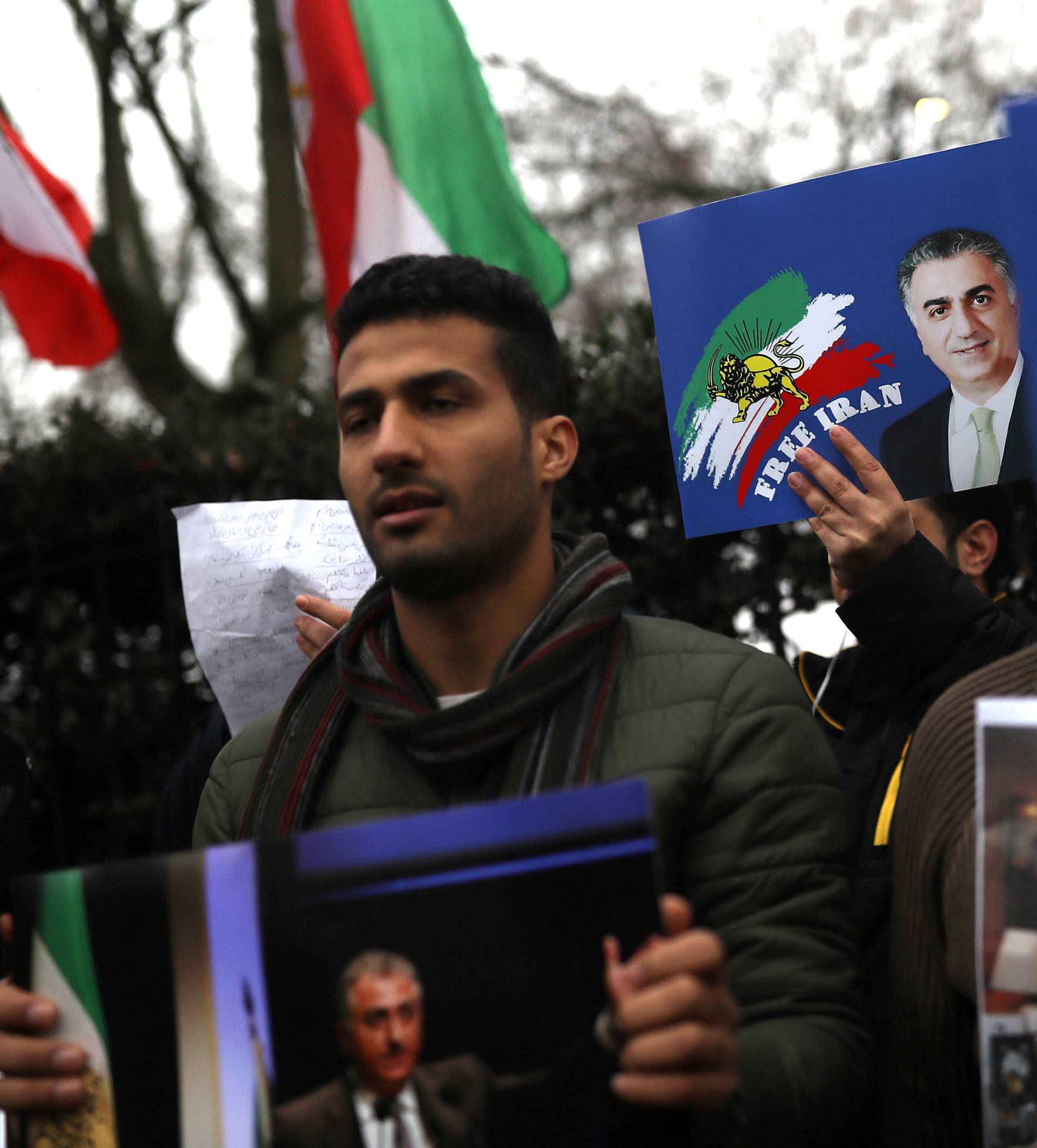 Opponents of Iranian President Hassan Rouhani hold a protest outside the Iranian embassy in west London