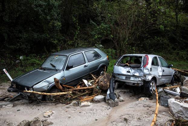 A view of damaged vehicles at a flooded residential area in Donja Jablanica