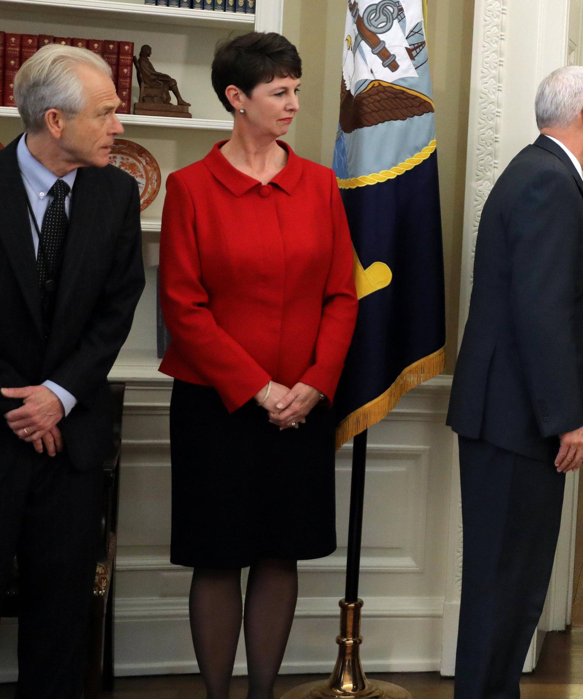 U.S. President Donald Trump leaves without signing executive orders on trade as Vice President Mike Pence reacts during a signing ceremony at the Oval Office of the White House in Washington, U.S.