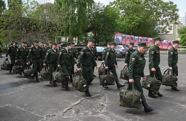 Russian conscripts called up for military service depart from a recruitment centre in Bataysk