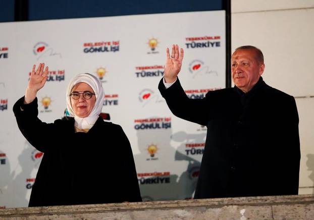 Turkish President Tayyip Erdogan and his wife Emine greet supporters in Ankara