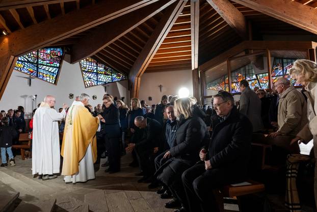 Sunday Mass at the chapel of Saint-Christophe dedicated to the victims of the fire at the 'Le Constellation' bar and lounge