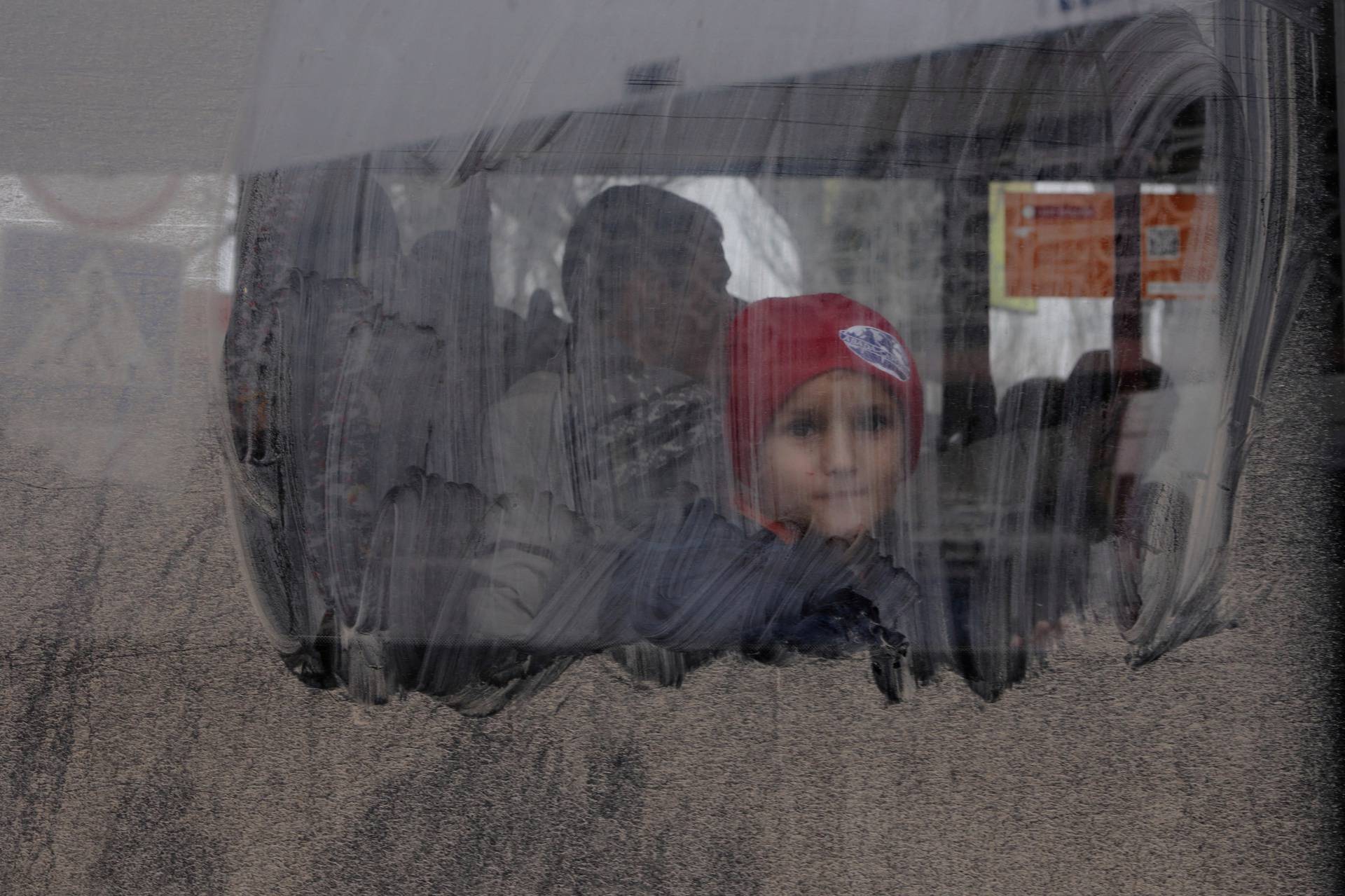 Residents take an evacuation bus in Kherson