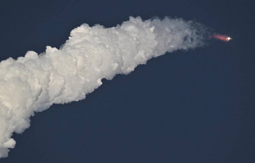 A SpaceX Super Heavy booster carrying the Starship spacecraft lifts off on its 10th test flight