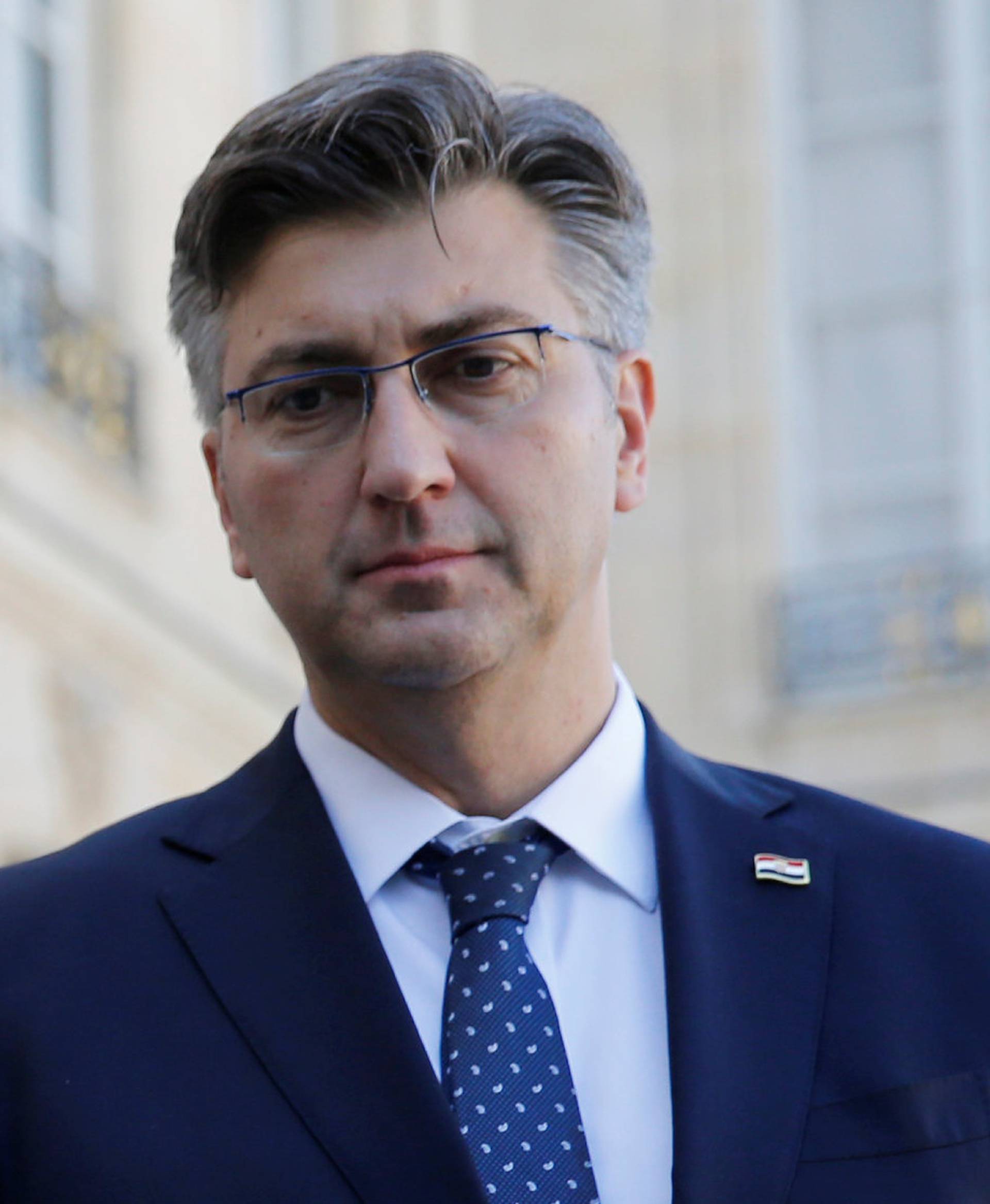 French President Emmanuel Macron and Croatian Prime Minister Andrej Plenkovic make a statement in the courtyard of the Elysee Palace in Paris