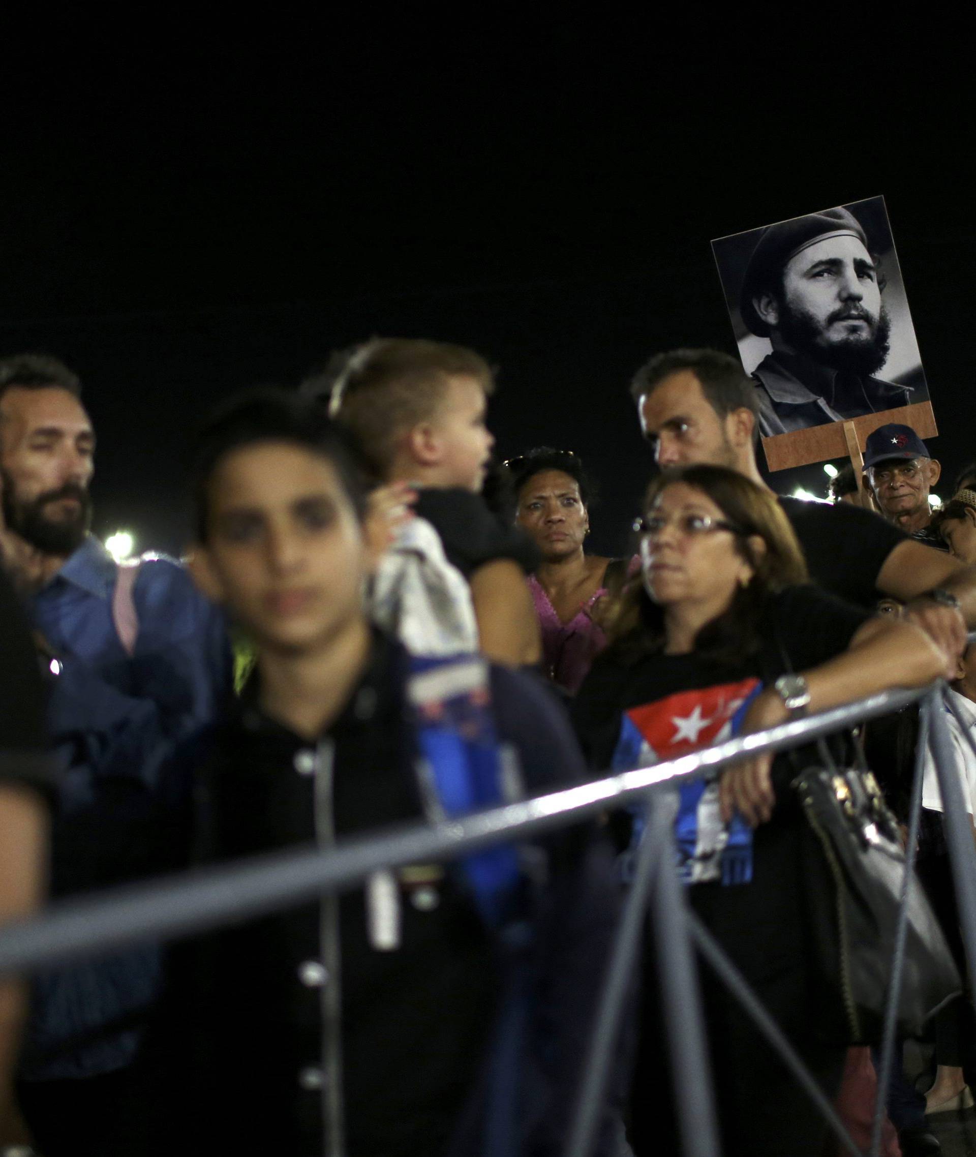 People wait in line to pay tribute to Cuba's late President Fidel Castro at the Jose Marti Memorial in Revolution Square in Havana