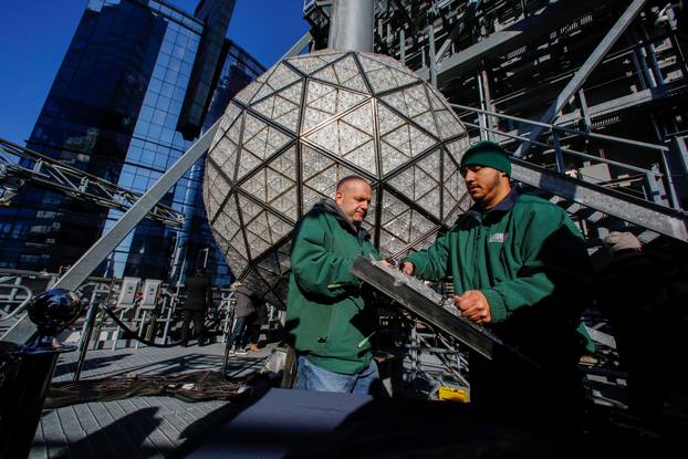 Workers prepare a panel of Waterford Crystal triangles before attaching it to the Times Square New Year