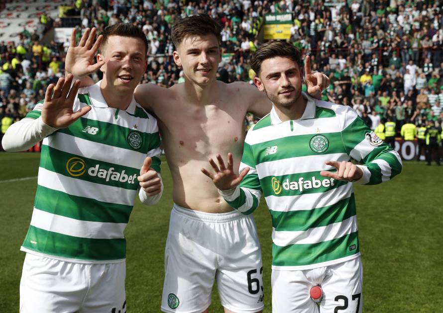 Celtic's Callum McGregor, Patrick Roberts and Kieran Tierney celebrate winning the Scottish Premiership
