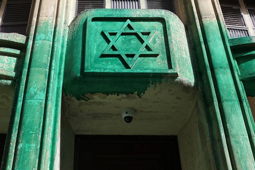 Agoudas Hakehilos synagogue covered in green paint, in Paris
