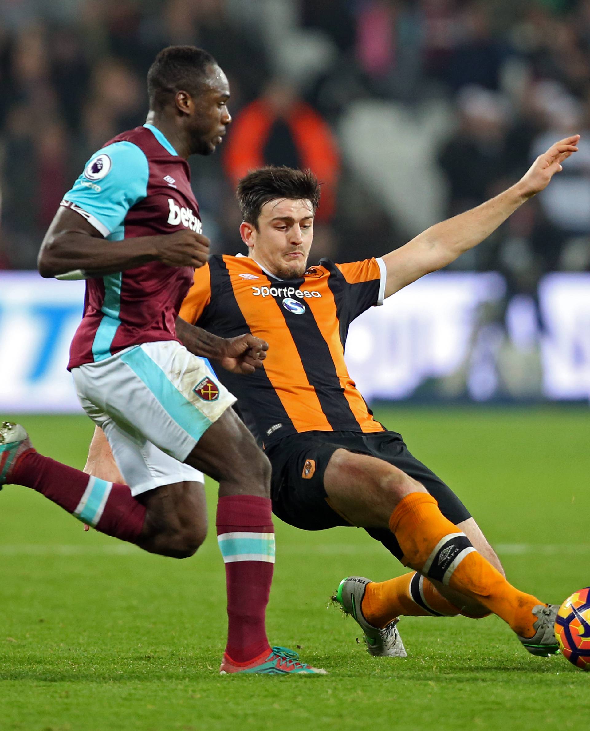 Hull City's Harry Maguire in action with West Ham United's Michail Antonio