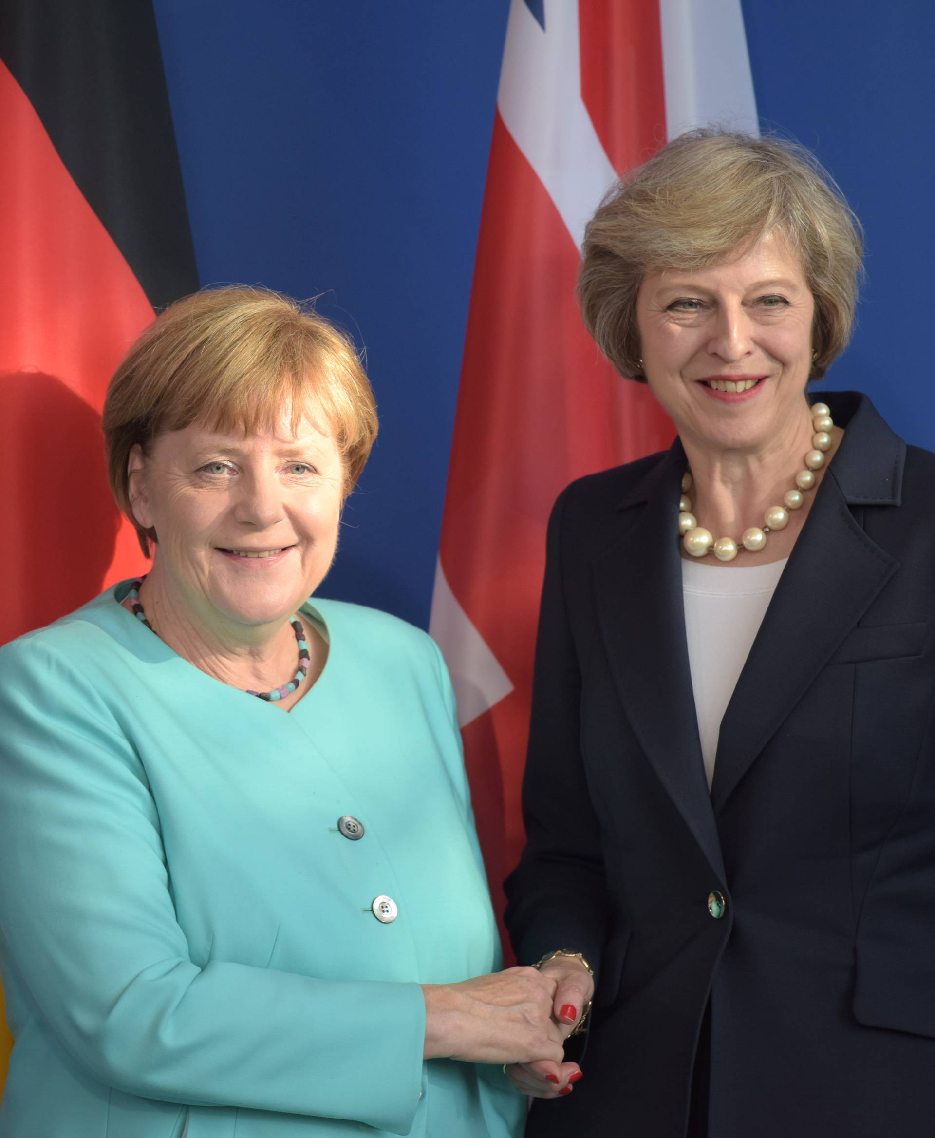 German Chancellor Merkel and British Prime Minister May shake hands after news conference in Berlin