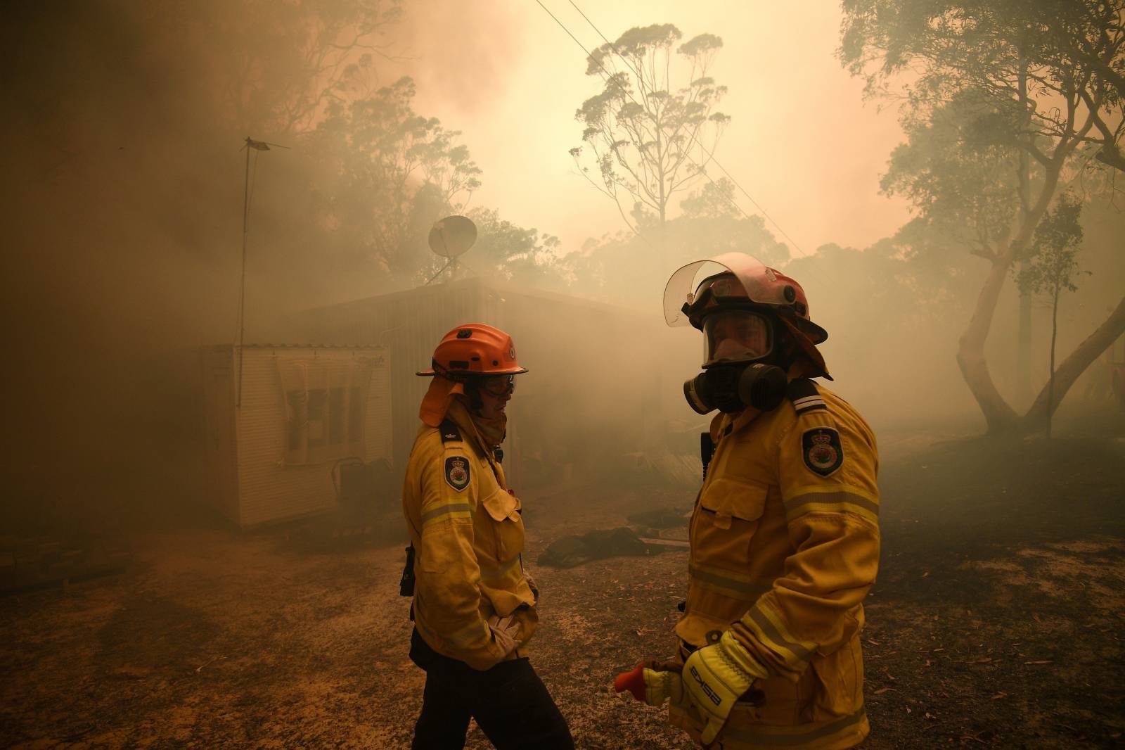 NSW Rural Fire Service and Fire and Rescue NSW crews work to protect a property on Kyola Road in Kulnura