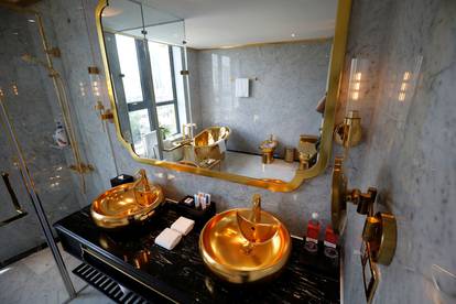 Gold plated bathroom sinks are seen in the newly-inaugurated Dolce Hanoi Golden Lake luxury hotel, after the government eased a nationwide lockdown following the global outbreak of the coronavirus disease (COVID-19), in Hanoi