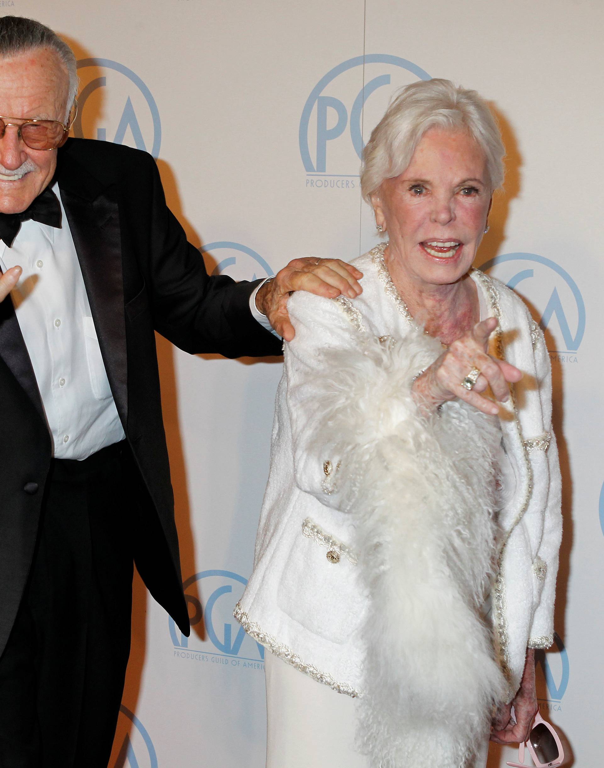 FILE PHOTO - Stan Lee, former president and chairman of Marvel Comics, and wife Joan gesture as they arrive at the 23rd annual Producers Guild Awards in Beverly Hills