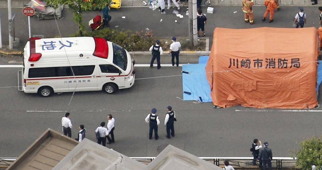An aerial view shows rescue workers and police officers operate at the site where sixteen people were injured in a suspected stabbing by a man, in Kawasaki