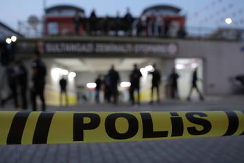 Turkish police officers stand guard outside a car park where a vehicle belonging to Saudi Arabia's consulate was found, in Istanbul