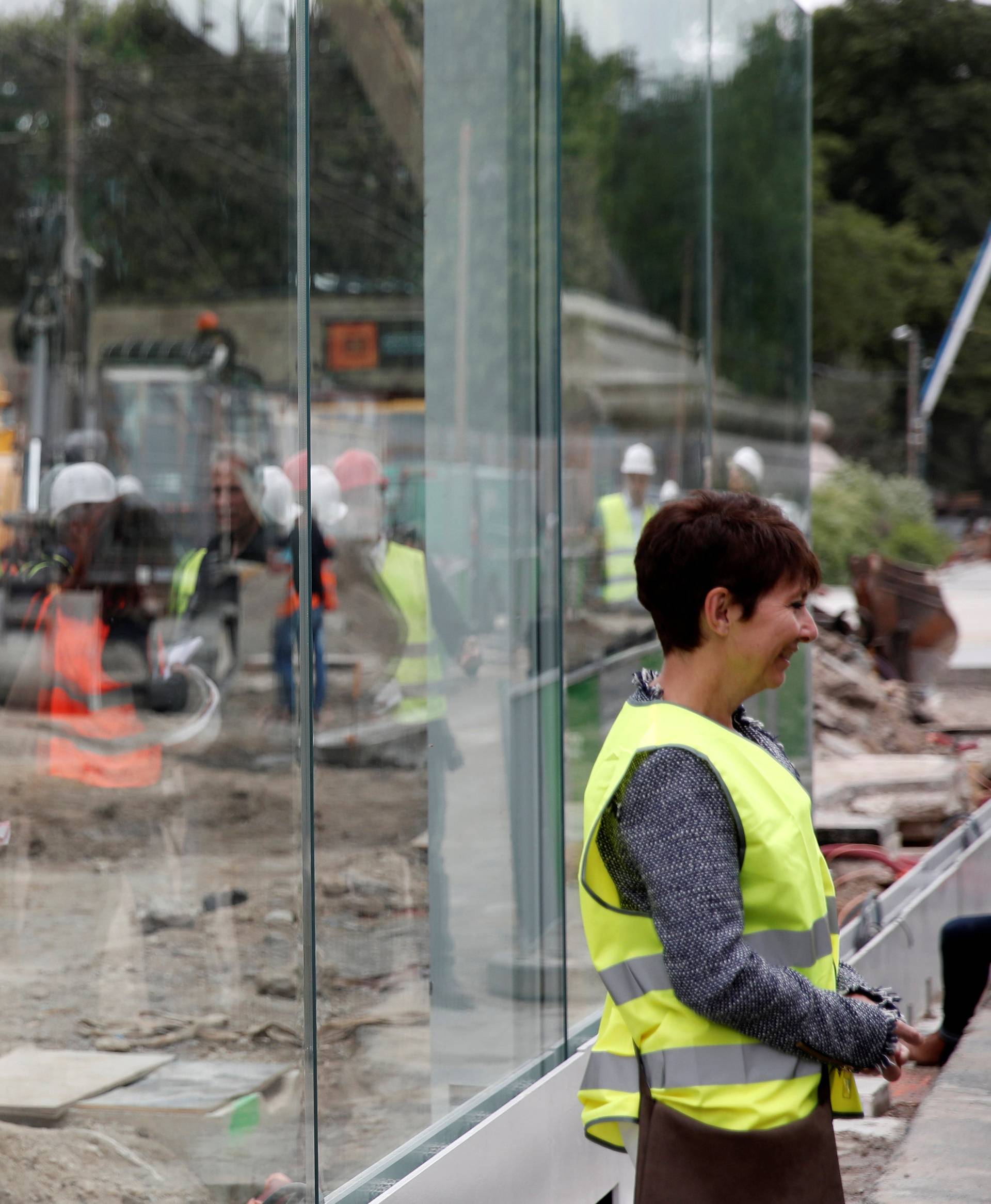 The new glass security fence, that is under construction, is seen around the Eiffel Tower in Paris