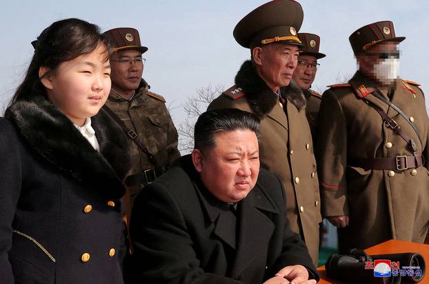FILE PHOTO: North Korean leader Kim Jong Un watches missile drill