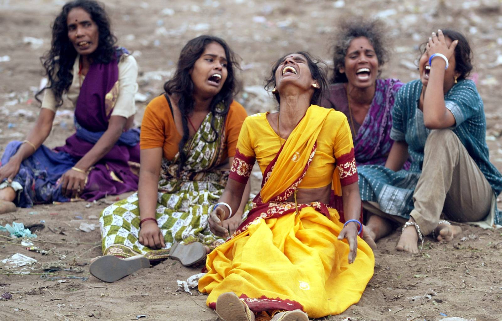FILE PHOTO: Women mourn the death of victims killed when a tsunami hit in Cuddalore
