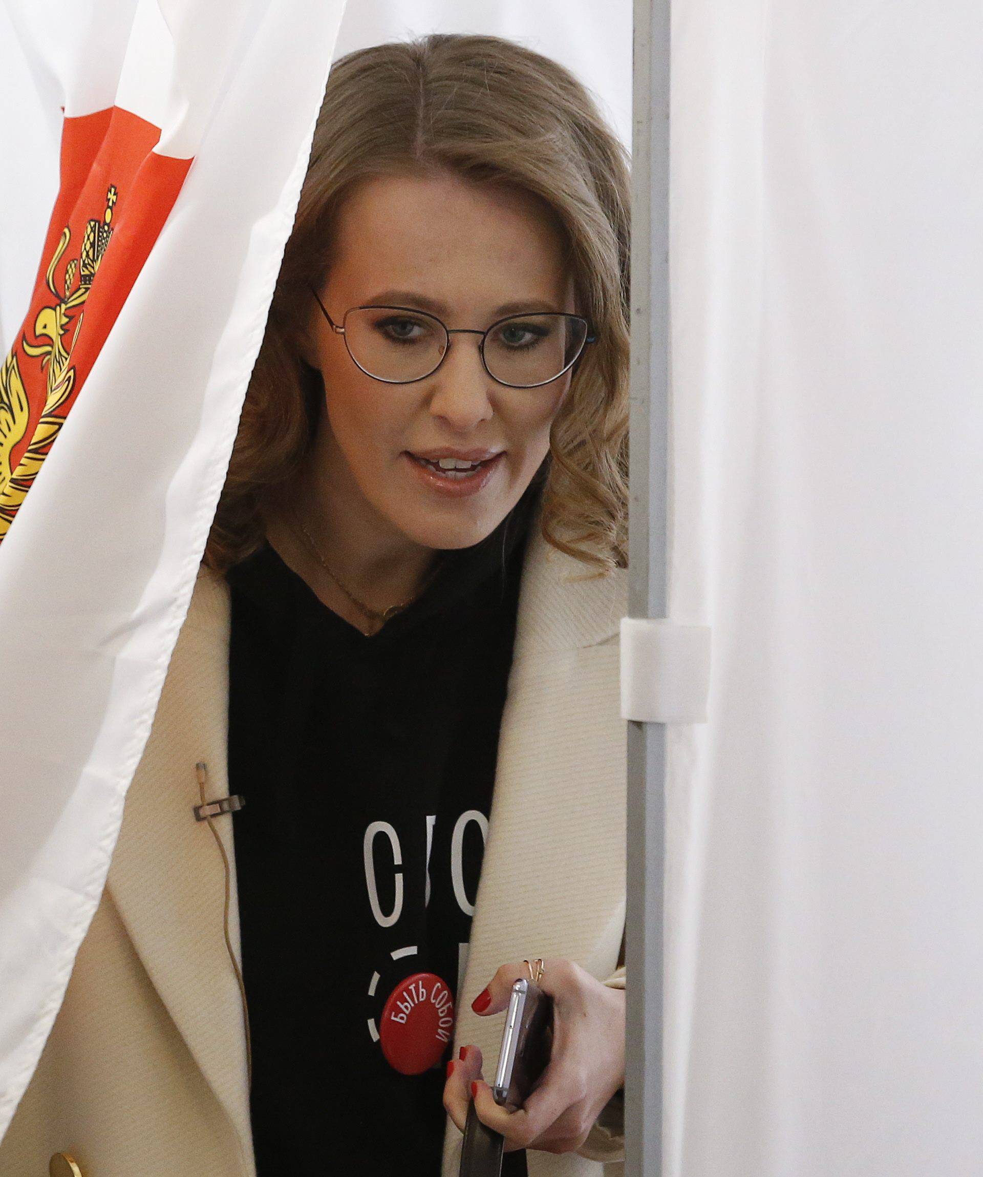 Presidential candidate Sobchak visits a polling station during the presidential election in Moscow