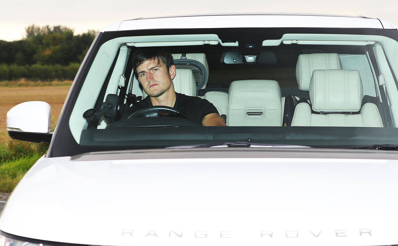 Manchester United players arrive for a training session - AON Carrington Training Complex