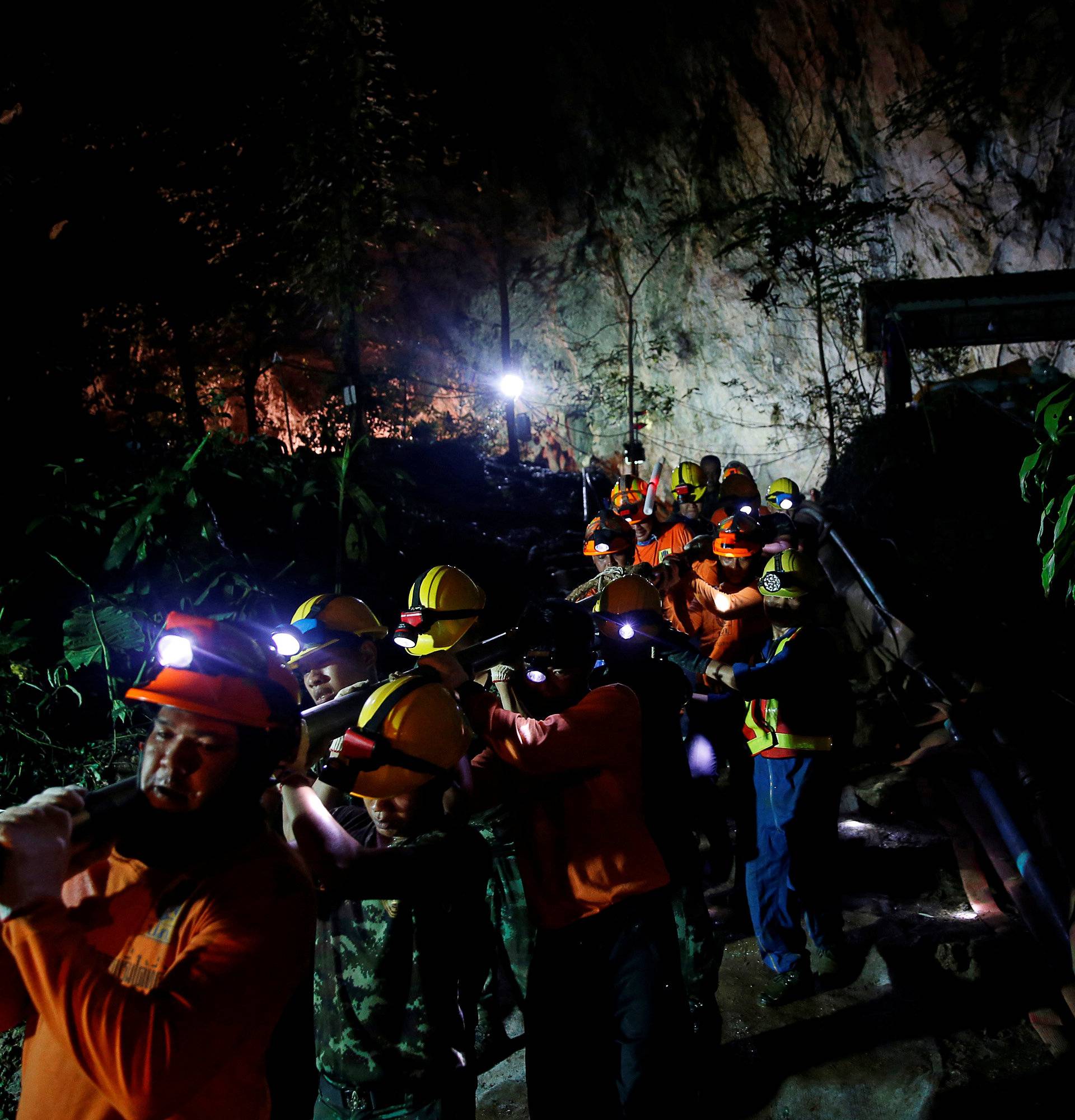 Rescue workers take out machines after 12 soccer players and their coach were rescued in Tham Luang cave complex in the northern province of Chiang Rai