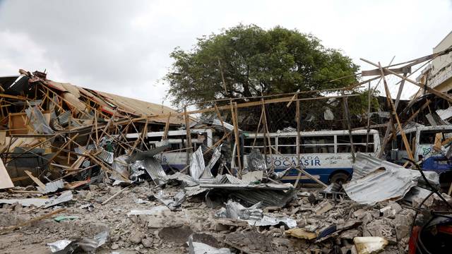 A view shows the damaged structures and school buses at the scene after a car exploded in a suicide attack near Mucassar primary and secondary school in Hodan district of Mogadishu
