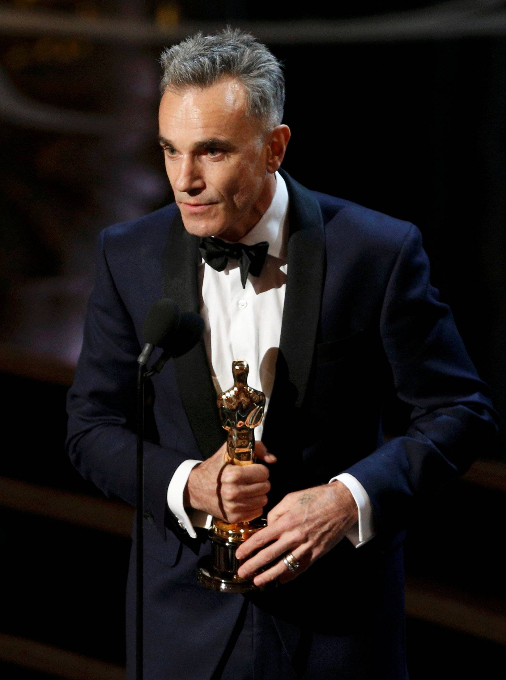 FILE PHOTO: Lewis accepts the Oscar for best actor for his role in "Lincoln," at the 85th Academy Awards in Hollywood