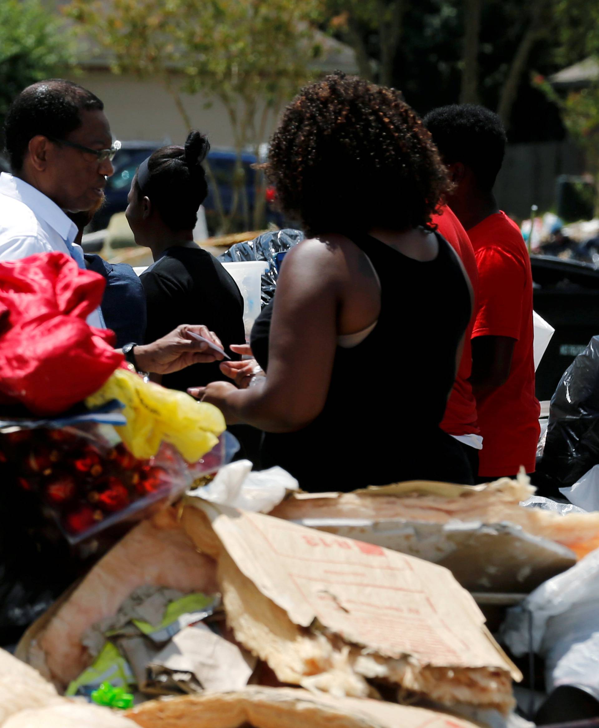 U.S. President Barack Obama tours a flood-affected neighborhood in Zachary