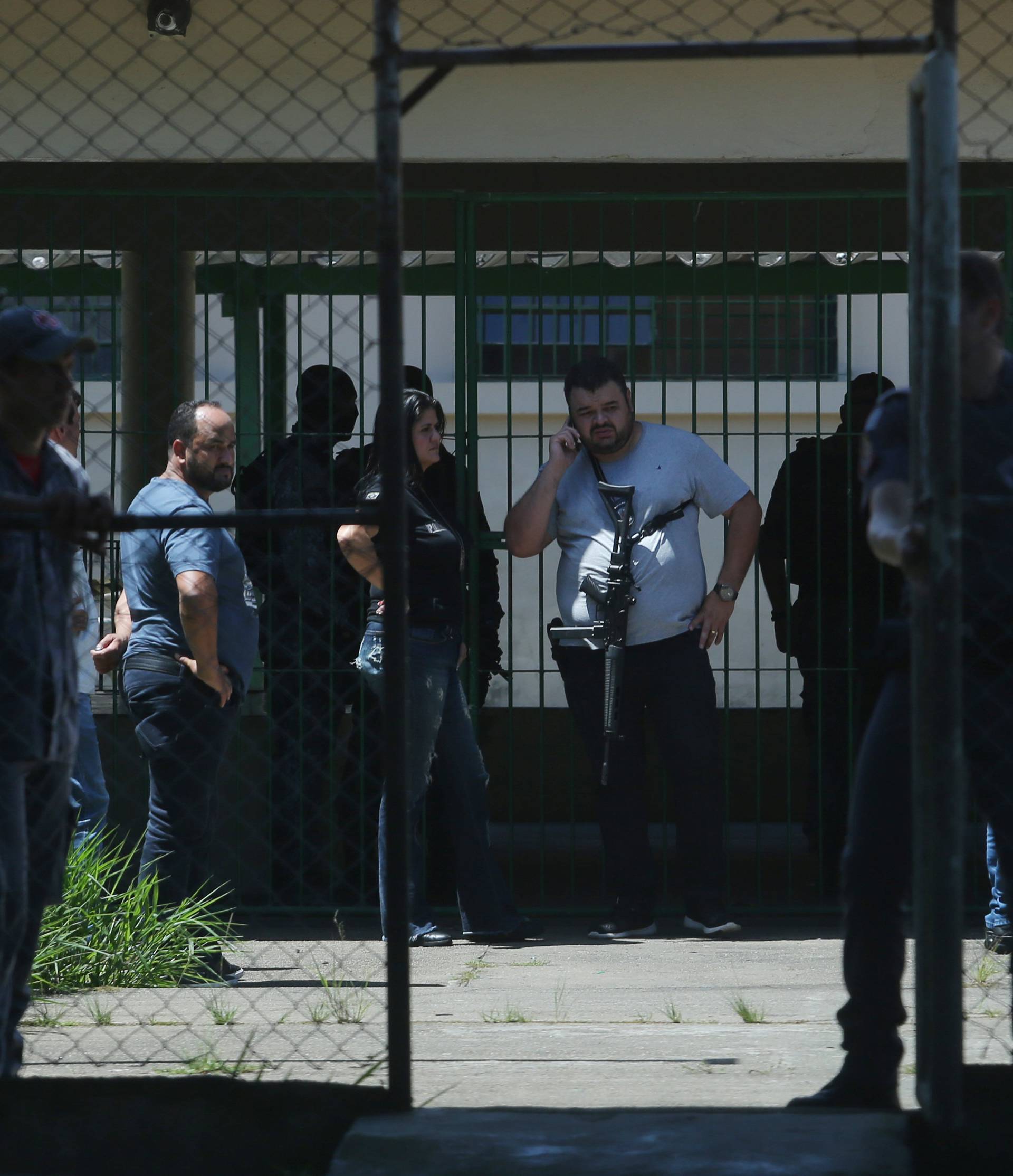 Policemen are seen at the Raul Brasil school after a shooting in Suzano