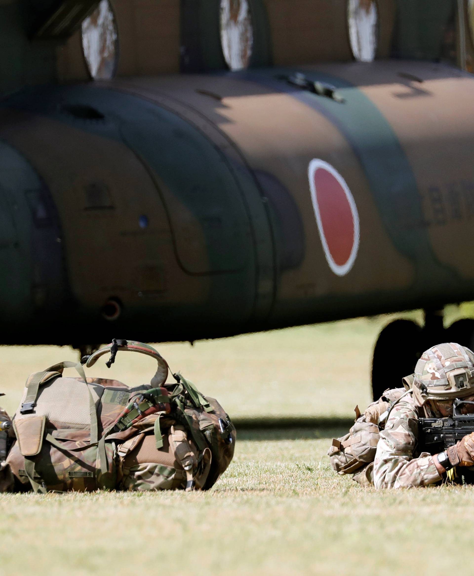 Members of the British Army take part in their first joint exercise with JGSDF at the JGSDF Camp Fuji in Oyama town