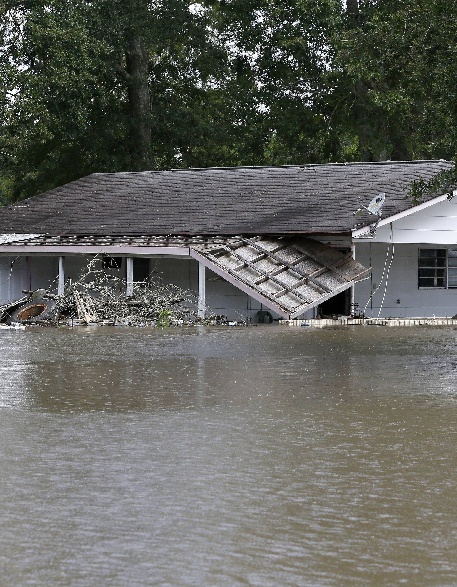 A flooded home is seen in St. Amant