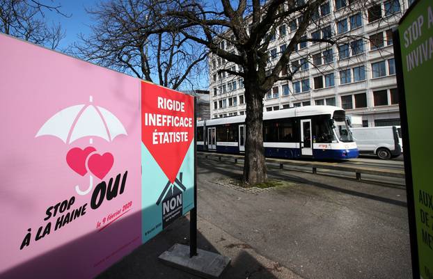 A poster in favour of the change of the penal code is pictured ahead of a referendum on anti-homophobia law in Geneva