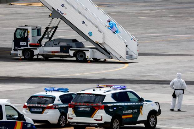 Passengers of the cruise ship MV Hondius, which was affected by a hantavirus outbreak, arrive at Tenerife Sud airport