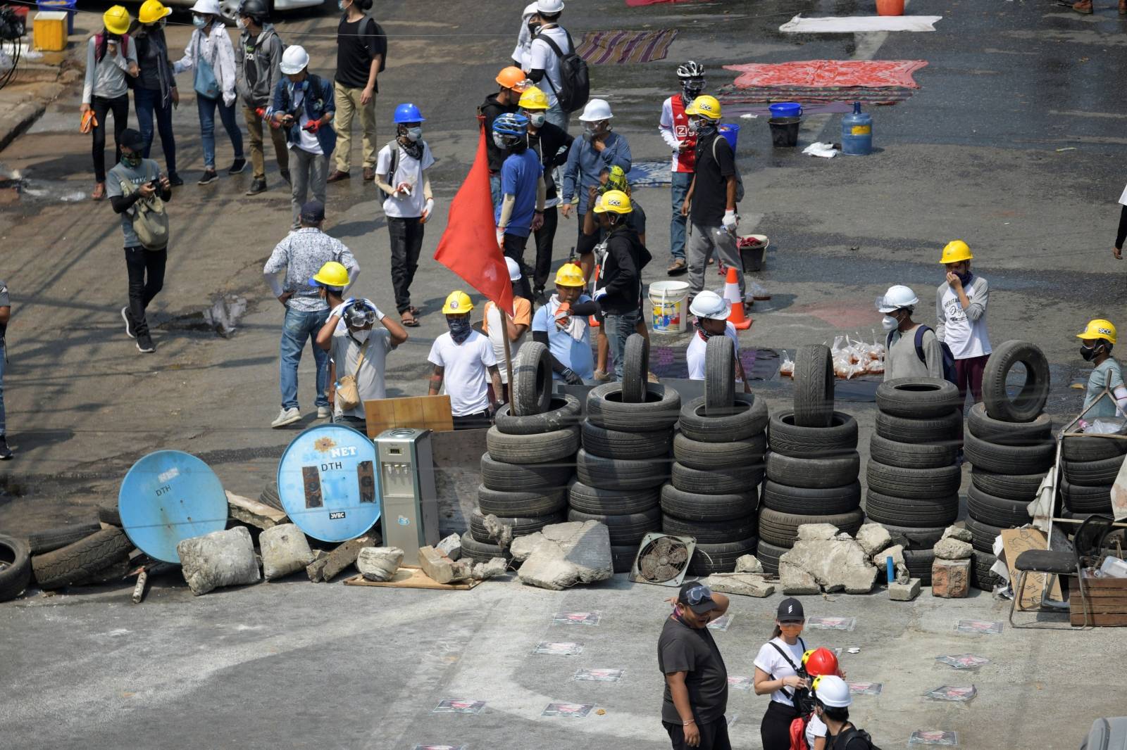 Protesters are seen in a barricade during an anti-coup protest in Yangon