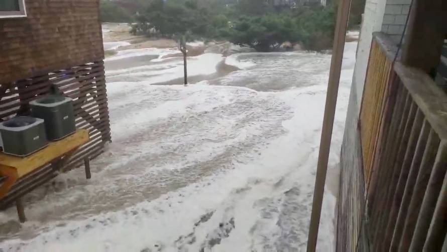 Waves are seen coming ashore in Avon