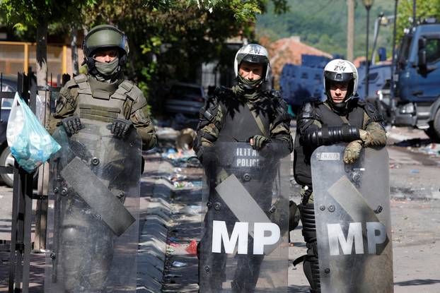 Polish Kosovo Force (KFOR) soldiers guard a municipal office in Zvecan