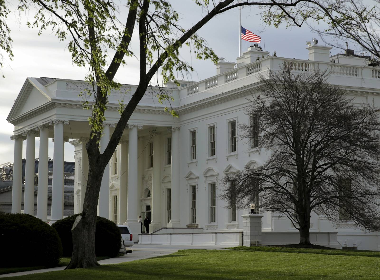 FILE PHOTO: The U.S. flag flies at half-staff at the White House in Washington