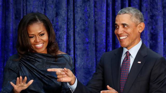 FILE PHOTO: Former U.S. President Obama and first lady Michelle Obama acknowledge guests during  portraits unveiling at the Smithsonianâs National Portrait Gallery in Washington