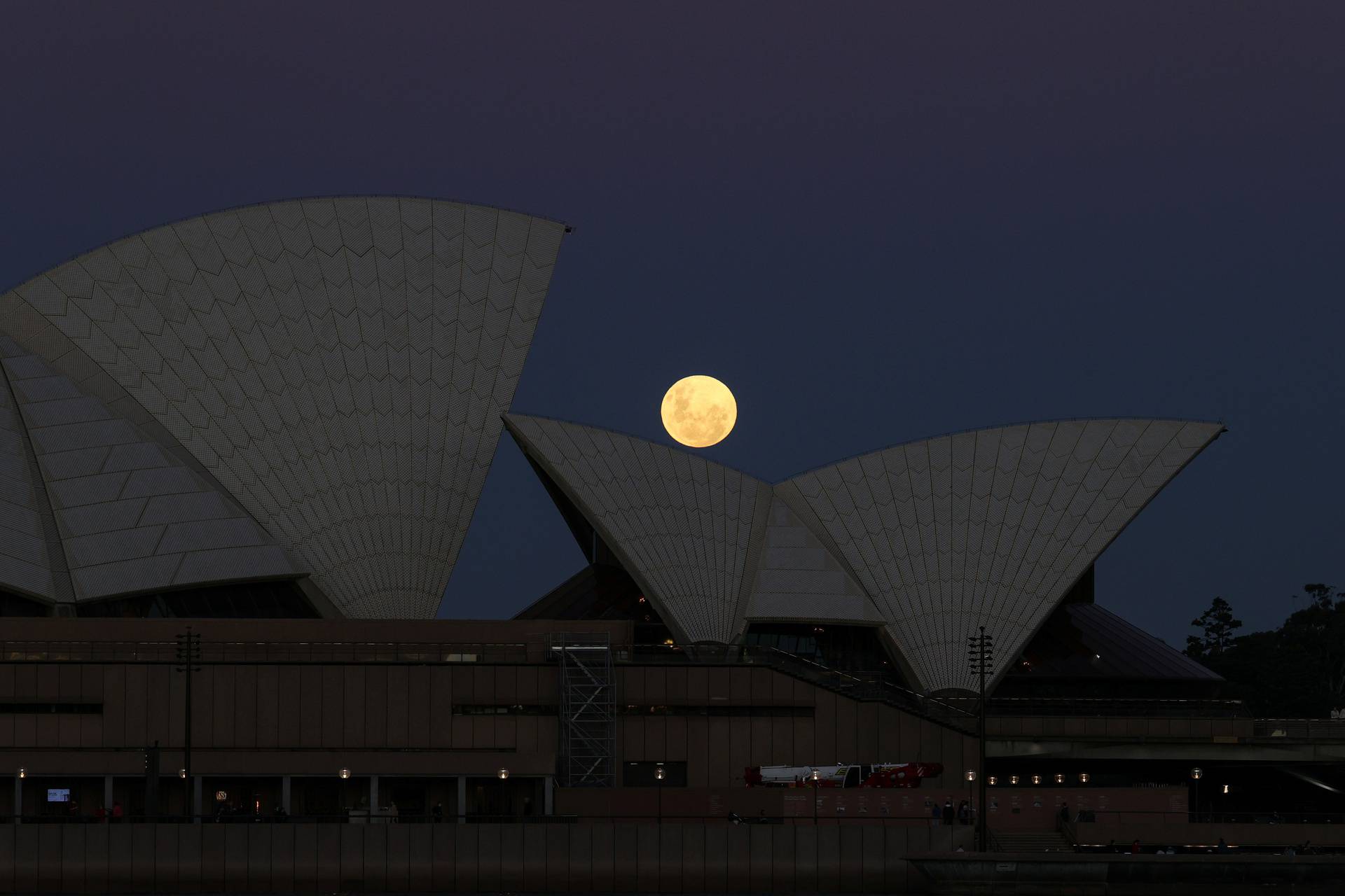 A Super Flower Moon rises behind the Sydney Opera House in Sydney